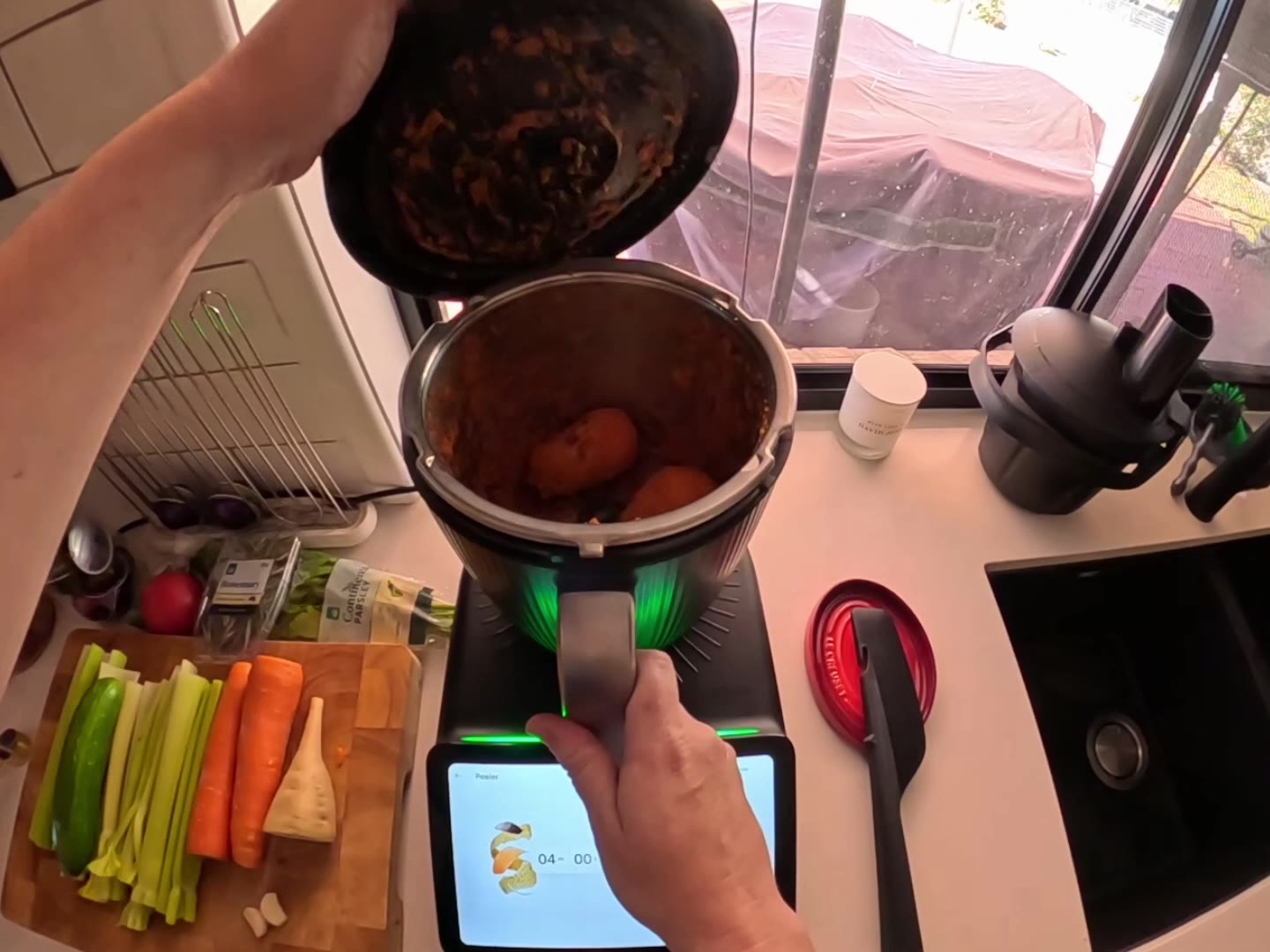The Thermomix TM7 Peeler running on sweet potato, with the screen showing four minutes.